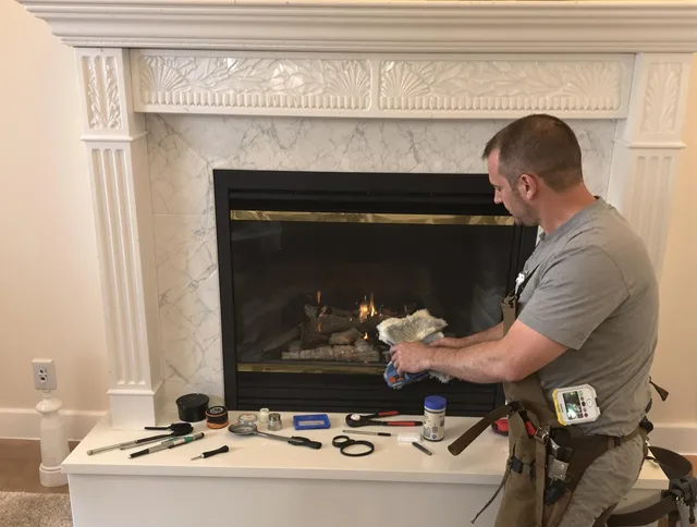 Parma Heights Chimney Sweep performing fireplace maintenance in Parma Heights, OH